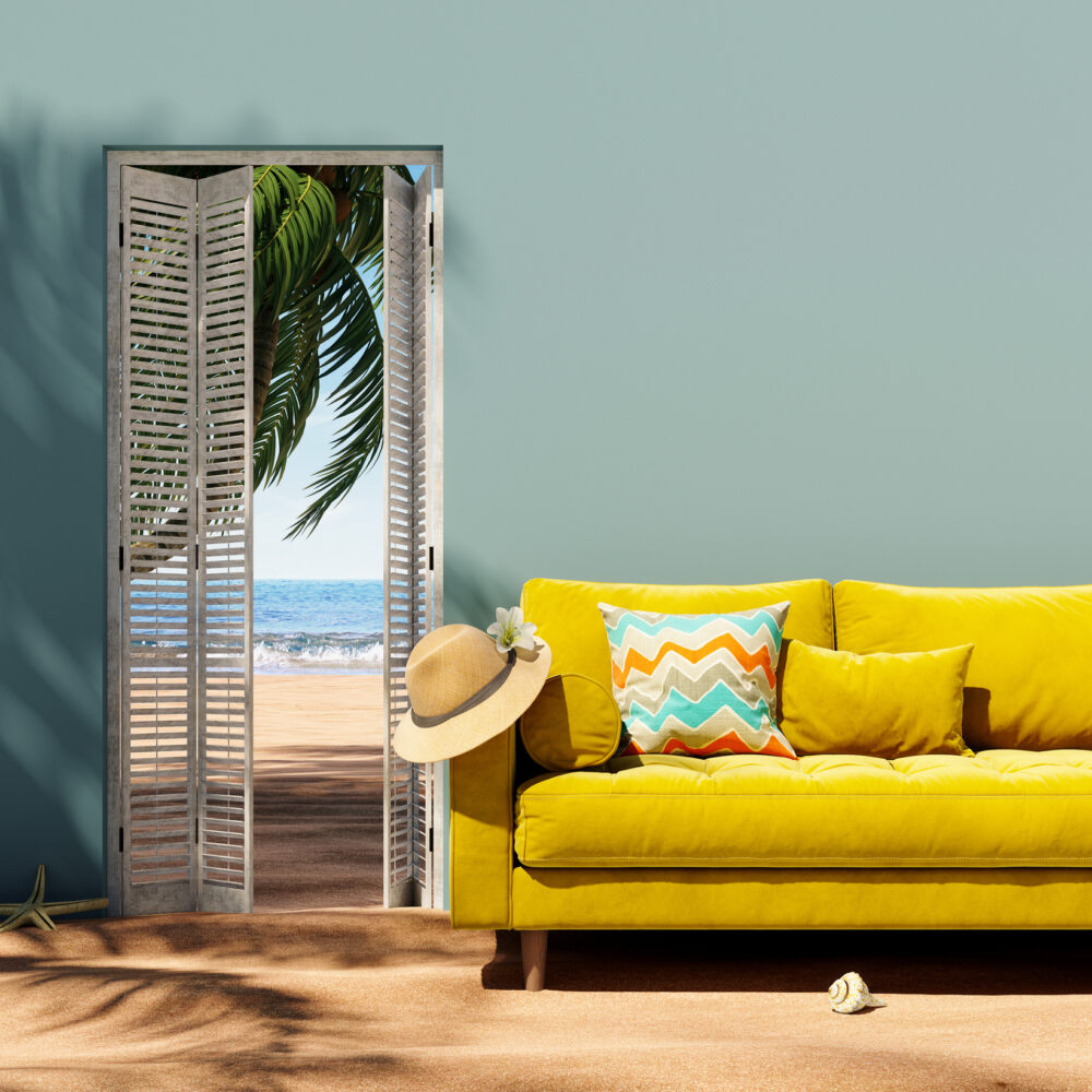 Interior on the sand beach with yellow sofa and open white door looking at sea. Vacation at home concept. 3D Rendering, 3D Illustration